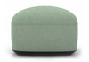 Byorne Low Back Stool in dusty teal, dark grey and pebble upholstery, featuring a compact sculpted form with a low contemporary profile. Built with high-density moulded foam and a welded steel internal frame for lasting comfort and structure, the stool is supported by injected-moulded nylon legs for stability. Designed to integrate seamlessly with other Byorne modular seating elements or function as a standalone piece in lounges, reception areas and modern hospitality interiors.