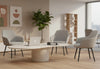 Keebu Office Lounge Chairs arranged around a marble coffee table in a contemporary breakout room, featuring three upholstered lounge chairs set on wooden flooring with beige and white walls, tall ceilings and large windows, highlighting modern lounge seating for office and collaborative environments.