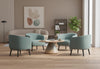 Keebu Breakout Lounge Chairs arranged in a comfortable breakout room, featuring four upholstered lounge chairs on wooden flooring with beige walls and high ceilings, showcasing modern seating for relaxed office and collaborative spaces.