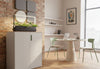 Moda Office Storage Cabinet in a collaborative office setting with exposed brick and white walls, high ceilings, tall windows, and a table with two chairs. The cabinet features a durable powder-coated surface, ABS handles, damping buffer hinges, a front lock, and a laminate top, providing functional and stylish storage for modern workspaces.