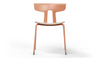 Okse Nord Stackable Chair on white background in coral featuring a moulded PP-GF25 back, poplar plywood seat and powder-coated steel frame for durable, modern, space-efficient seating.