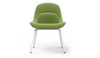 Bloom ergonomic office chair by Quell Design — green upholstered contoured seat with linen-velvet and eco PU panels, mounted on slender black steel legs with subtle wraparound support structure. Elegant and sculptural, the chair adds refined comfort and modern design to contemporary interiors.